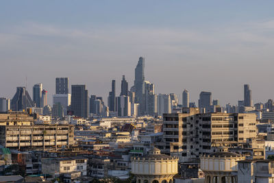 Modern buildings in city against sky