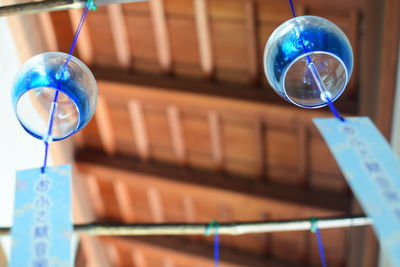 Low angle view of crystal ball hanging in building