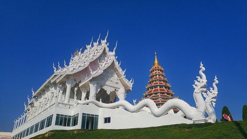 Low angle view of temple against building