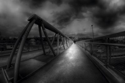 View of bridge against cloudy sky