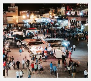 People on city street at night