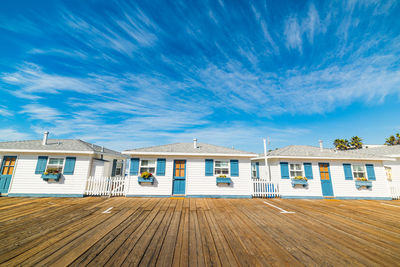 Houses and buildings against blue sky