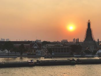 View of cityscape against sky during sunset