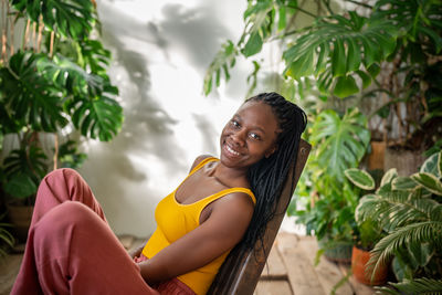 Young woman sitting on hammock