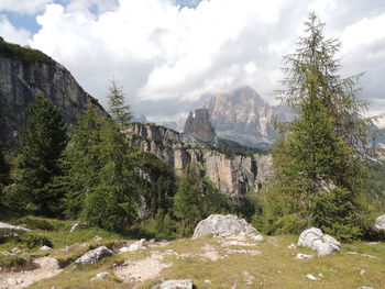 Scenic view of mountains against cloudy sky