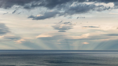 Scenic view of sea against sky at sunset