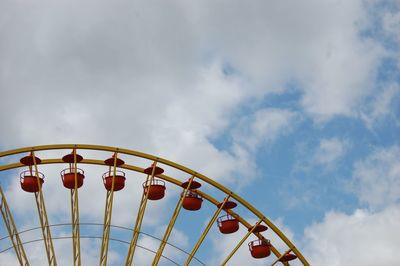 Low angle view of ferris wheel against sky