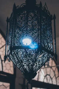 Low angle view of illuminated lantern on ceiling