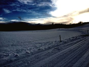 Scenic view of snow covered mountains against sky