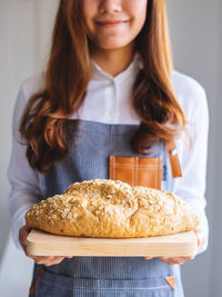 Close-up of woman holding food