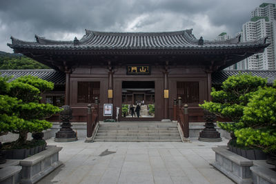 Entrance of temple against building