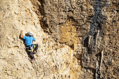 Low angle view of person on rock