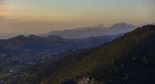 Scenic view of mountains against sky during sunset