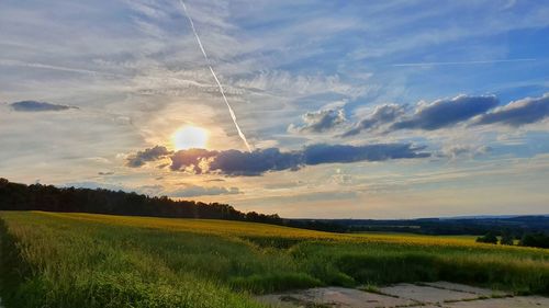 Scenic view of landscape against sky during sunset