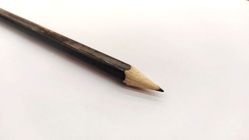 High angle view of pencils against white background