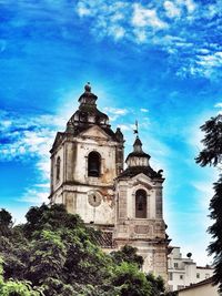 Low angle view of built structure against blue sky