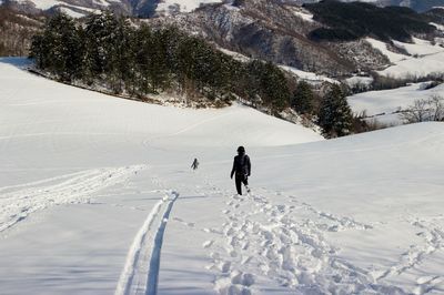 Person skiing on snowcapped mountain