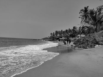 Scenic view of beach against clear sky