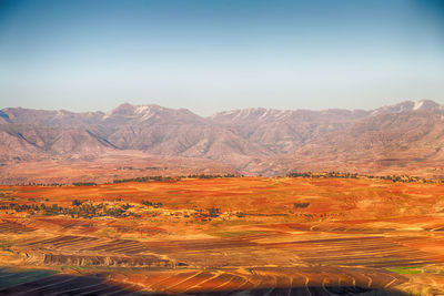 View of landscape against mountain range