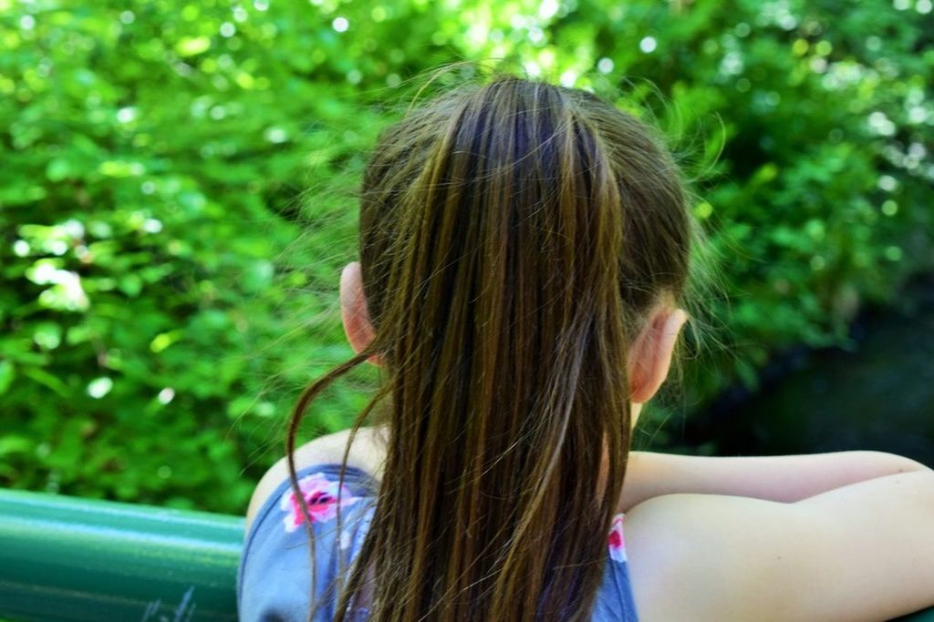 YOUNG WOMAN LOOKING AWAY