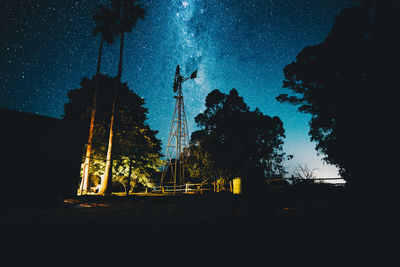 Low angle view of illuminated building against sky at night