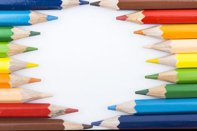 Close-up of multi colored pencils on table