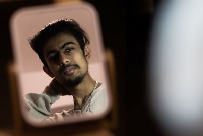 Portrait of young man looking away