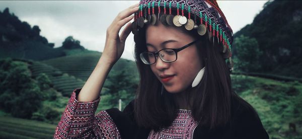 Close-up of young woman looking away