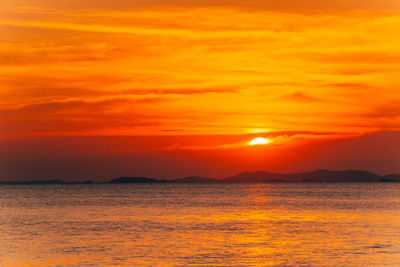 Scenic view of sea against romantic sky at sunset