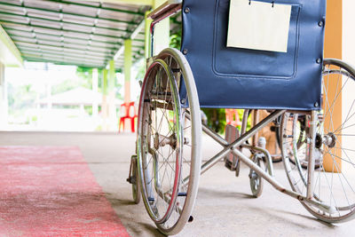 Close-up of empty wheelchair parked in hospital