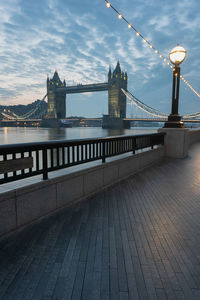 Bridge over river with city in background