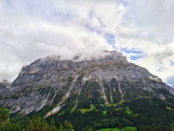 Low angle view of mountain range against sky