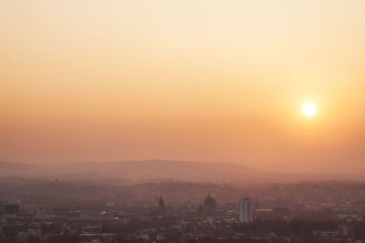 Cityscape against sky during sunset