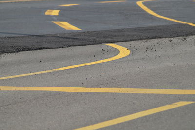 High angle view of arrow sign on road