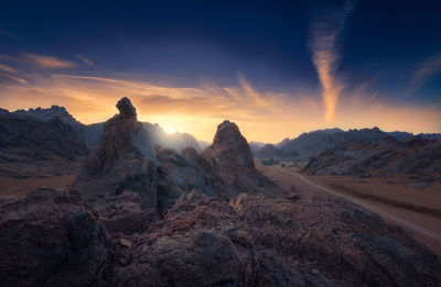 Scenic view of mountains at sunset