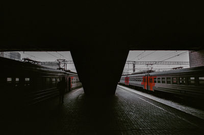 Train on railroad station platform at night