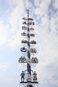 Low angle view of communications tower against sky