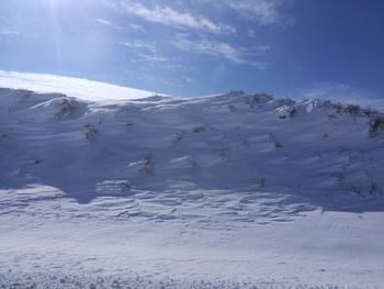 Scenic view of snow covered mountain against sky