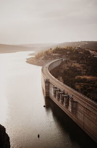 Bridge over river against sky