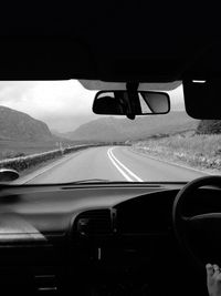 Cropped image of car on road