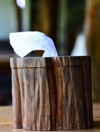 Close-up of wooden post on table