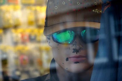 Close-up portrait of woman wearing sunglasses