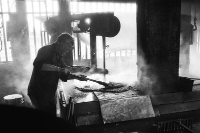 Side view of man working at home