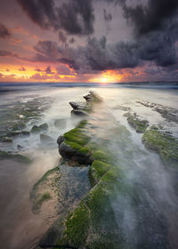 Scenic view of sea against sky during sunset