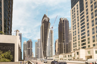 Modern buildings in city against sky