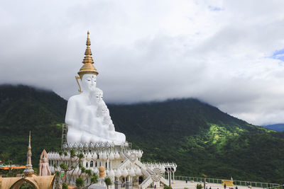 Statue by mountain at temple
