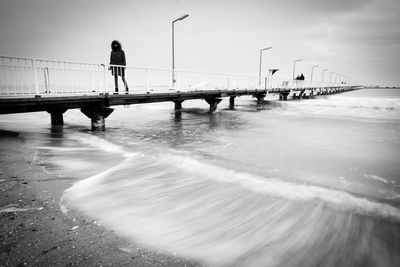 Man on beach against sky