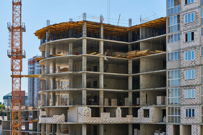 Low angle view of buildings against sky in city