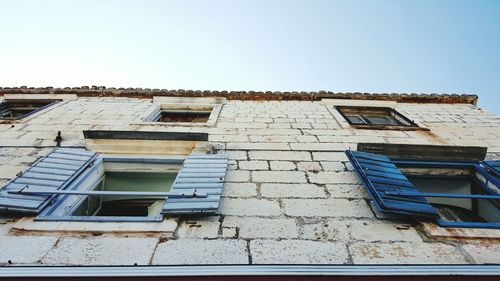 Low angle view of residential building against clear sky