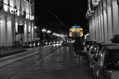 Street lights in illuminated city at night